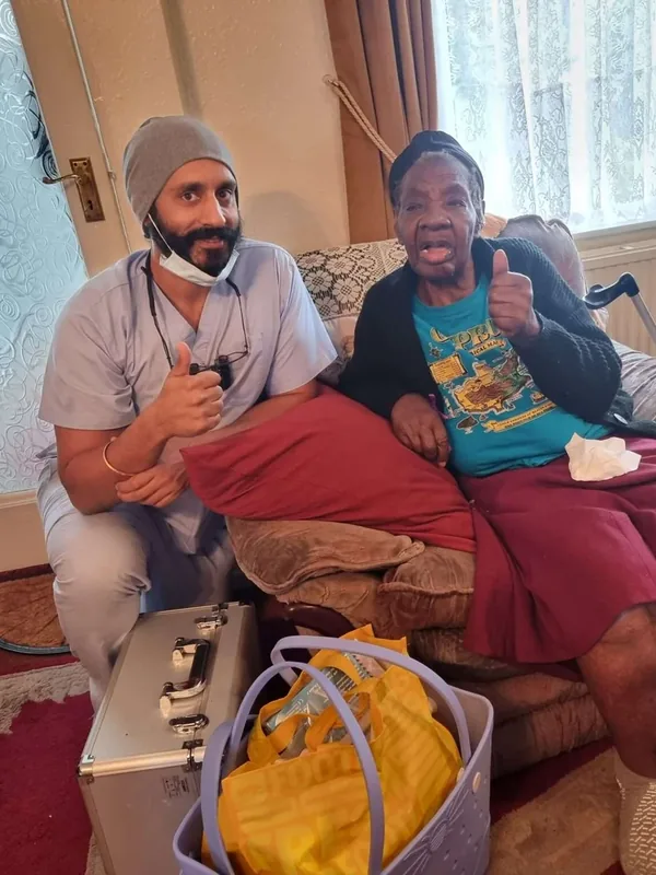 Home visit dentist and patient at home, dental kit ready